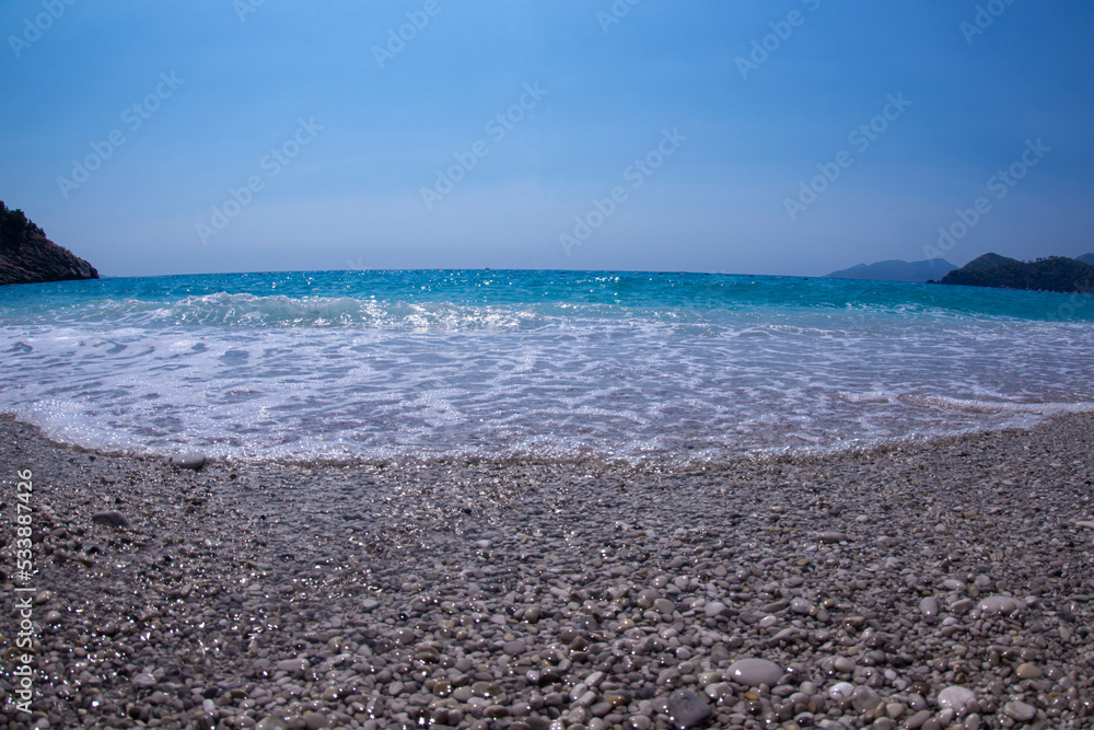 Long exposure by the sea. Waves break against stones. Sunset at the beach. Long exposure at night by the sea. Patara Beach Antalya Turkey Long exposure by the sea. Waves break against stones. Sunset at the beach. Long exposure at night by the sea. Patara Beach Antalya Turkey