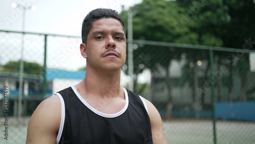 Portrait of a hispanic South American young man wearing sportwear with serious expression