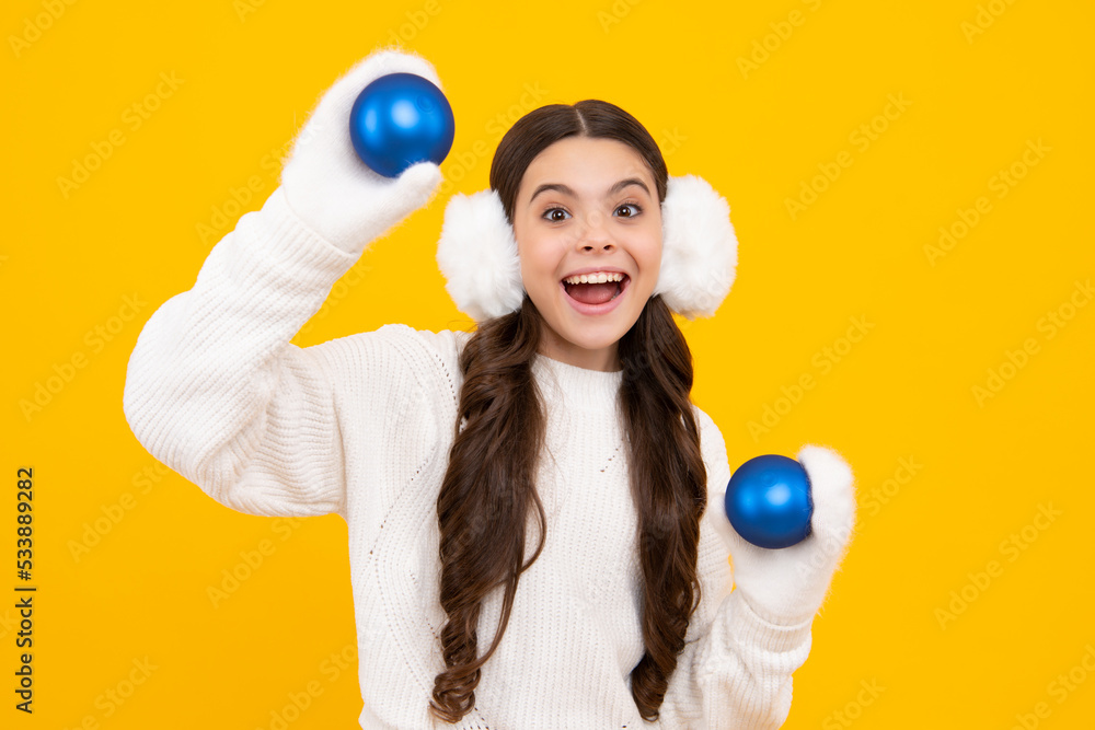 Fototapeta premium Santa girl in fur sweater isolated on yellow background. Happy New Year, Kids winter holiday concept. Happy face, positive and smiling emotions of teenager girl.