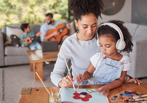 Art, love and happy family bonding in living room doing fun activity and relax together in their home. Learning, hobby and children enjoy time with parents in a music and creative picture painting