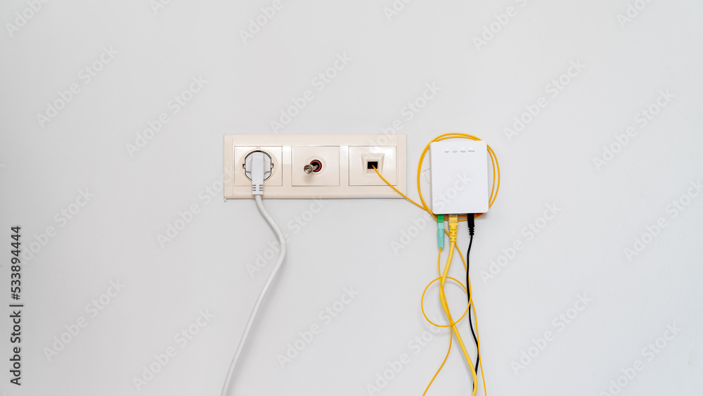 Socket with tangled wires, cables and Internet router on a white background