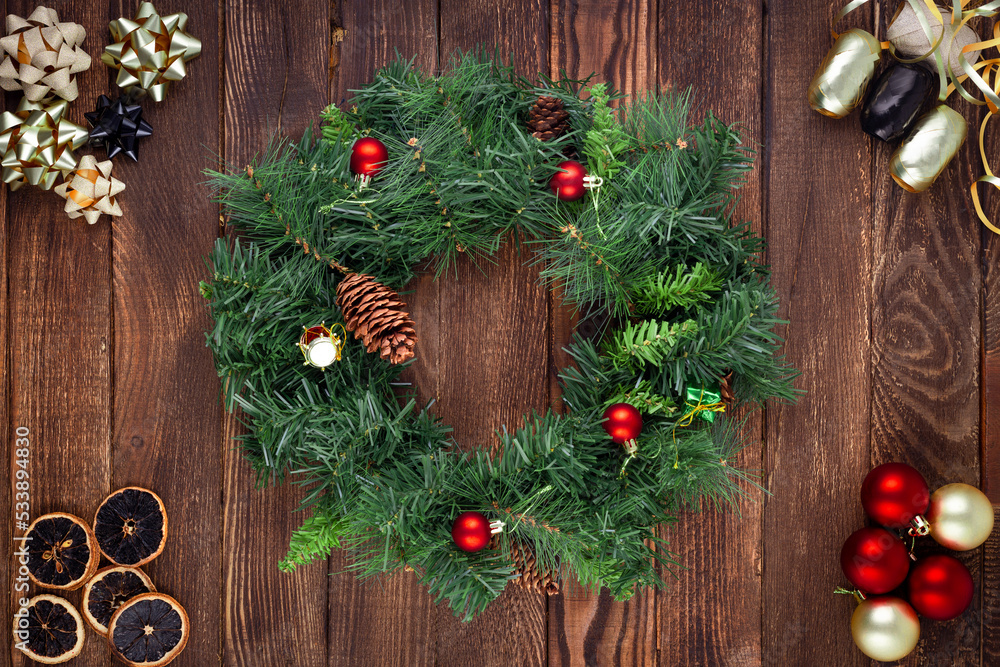 Christmas wreath on wooden background. Mock up. Greeting card. Christmas wreath on wooden background. Mock up. Greeting card.
