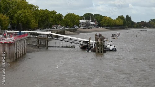 The multiple boats floating in Putney, viewed from Putney Bridge, London, United Kingdom photo