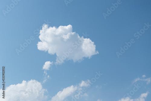 Part of the cloud separates in close up, airy clouds