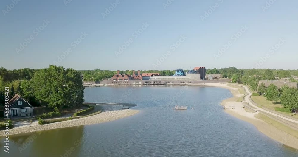 Panoramic drone view of people bathing on a platform in the lake of a holiday park in the Netherlands. Panoramic drone view of people bathing on a platform in the lake of a holiday park in the Netherlands.