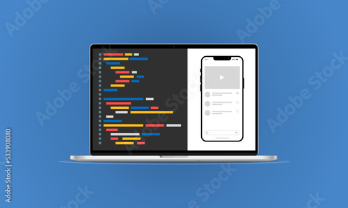 Computer with programming text on the laptop screen and simulated program on smartphone screen.