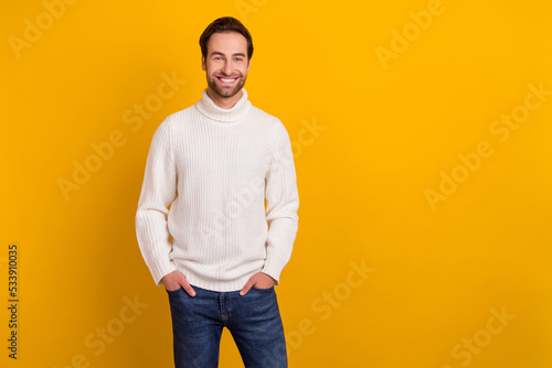 Fotografering Photo of cheerful attractive guy hands pockets enjoy new outfit wear white sweat