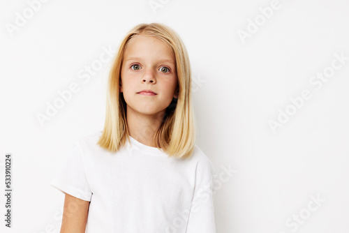 happy cute girl with blond hair on a light background