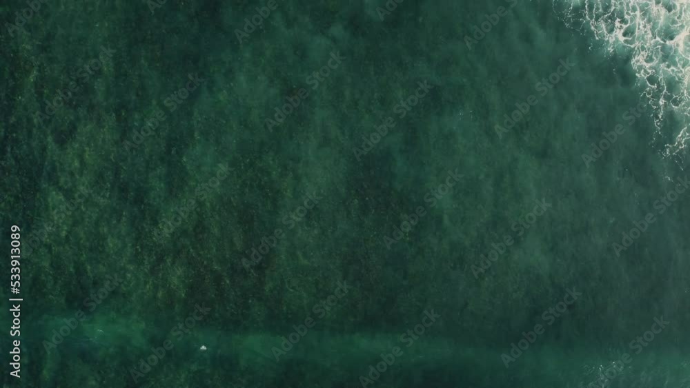 Tropical paradise island in the ocean with rocky shores and blue sea waves. Aerial view of beautiful vacation place Tropical paradise island in the ocean with rocky shores and blue sea waves. Aerial view of beautiful vacation place
