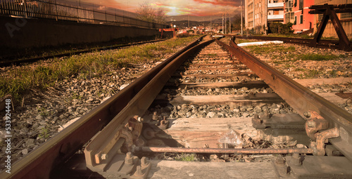 Binario ferroviario la Sera al tramonto photo
