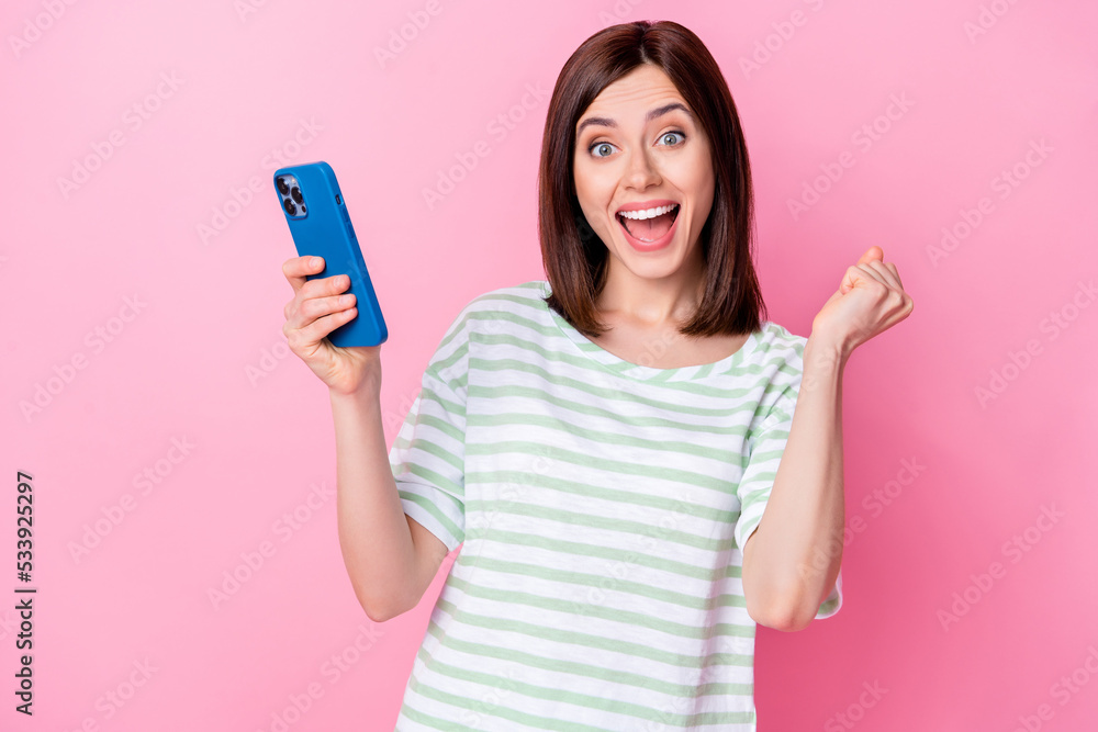 Portrait of cheerful satisfied stylish lady hold telephone rejoice buy cool quality purchase empty space isolated on pink color background Portrait of cheerful satisfied stylish lady hold telephone rejoice buy cool quality purchase empty space isolated on pink color background