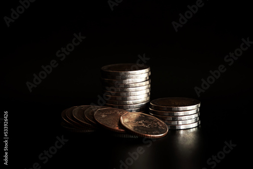 Wallpaper Mural Stack of coins on black background, Saving money concept Torontodigital.ca