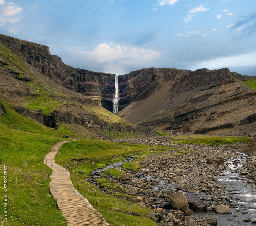 Hengifoss, 128 meters, in Fljótsdalshreppur, East Iceland. Surrounded by basaltic strata interspaced by clay layers.