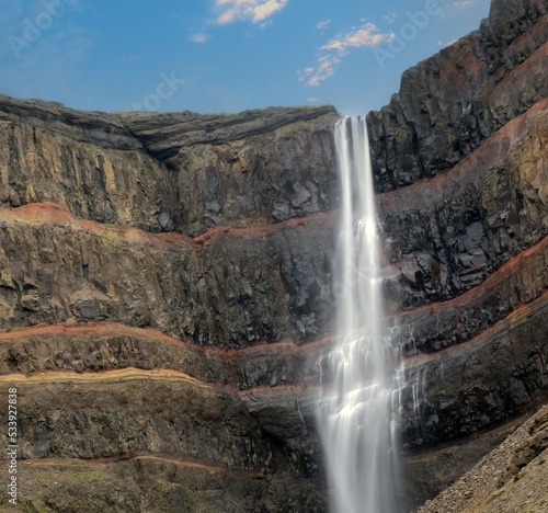 Hengifoss, 128 meters, in Fljótsdalshreppur, East Iceland. Surrounded by basaltic strata interspaced by clay layers.