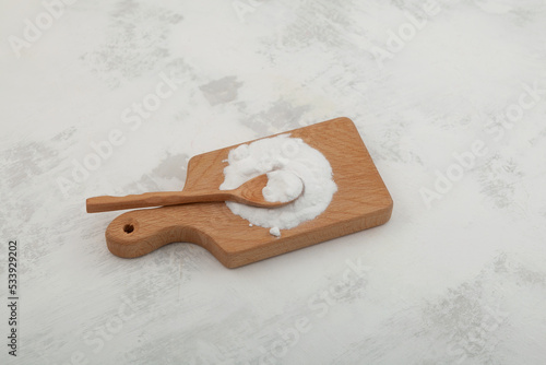 + Sodium Carboxymethyl Cellulose Powder on wooden board. NaCMC. Food additive E466, impart of property enhancements that bring high stability of texture food and beverages photo