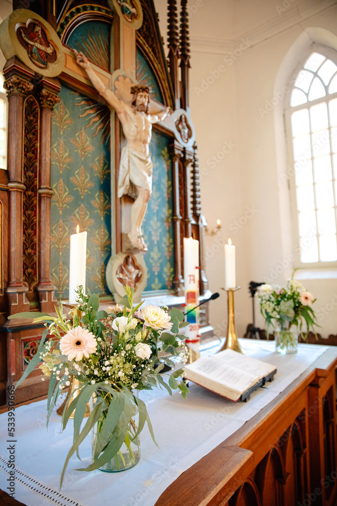 Decorated altar in a Protestant church in Germany. The Bible and