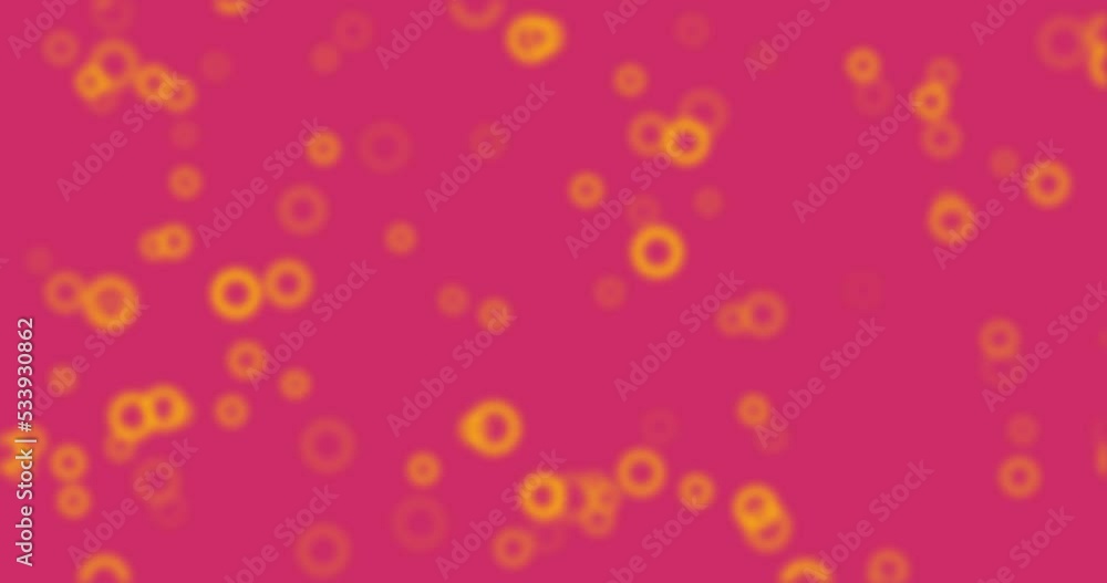 Abstract blurry circle particles flying on pink background. 4K rendered motion animation. Abstract blurry circle particles flying on pink background. 4K rendered motion animation.