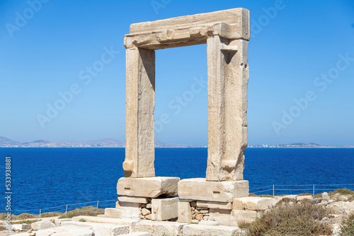 Naxos Portara, Temple of Apollo, Cyclades island, Greece. Sunny day, calm sea, blue sky background.