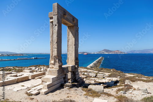 Naxos island, Temple of Apollo on islet of Palatia, Cyclades Greece. Sea, harbor, sky background.
