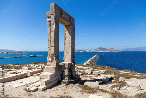 Naxos island, Temple of Apollo on islet of Palatia, Cyclades Greece. Sea, harbor, sky background. photo