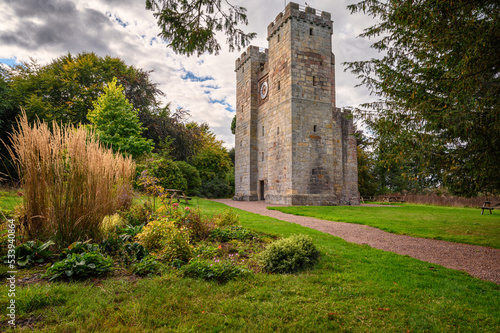 Preston Pele Tower and garden, which is a 14th century bastle of medieval construction located in Northumberland near the coast and was a fortified dwelling for protection against the Border Reivers photo
