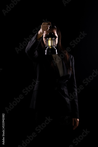 Business Woman hold light lamp lantern as lead the way out of problem, idea solution creativity inspire innovation success glowing your imagination invention. Concept Vision exit, copy space