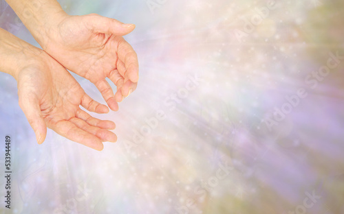 Humble Healing Hands Spiritual Message Template - Female open hands against a soft flowing ethereal pastel coloured background with space for holistic  message, inviation, or gift voucher text
