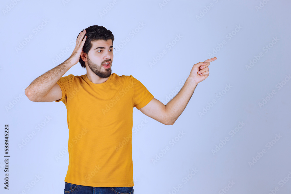Man pointing at something on the right side Man pointing at something on the right side