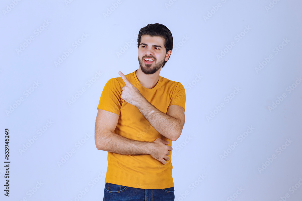 Man showing and pointing left side Man showing and pointing left side