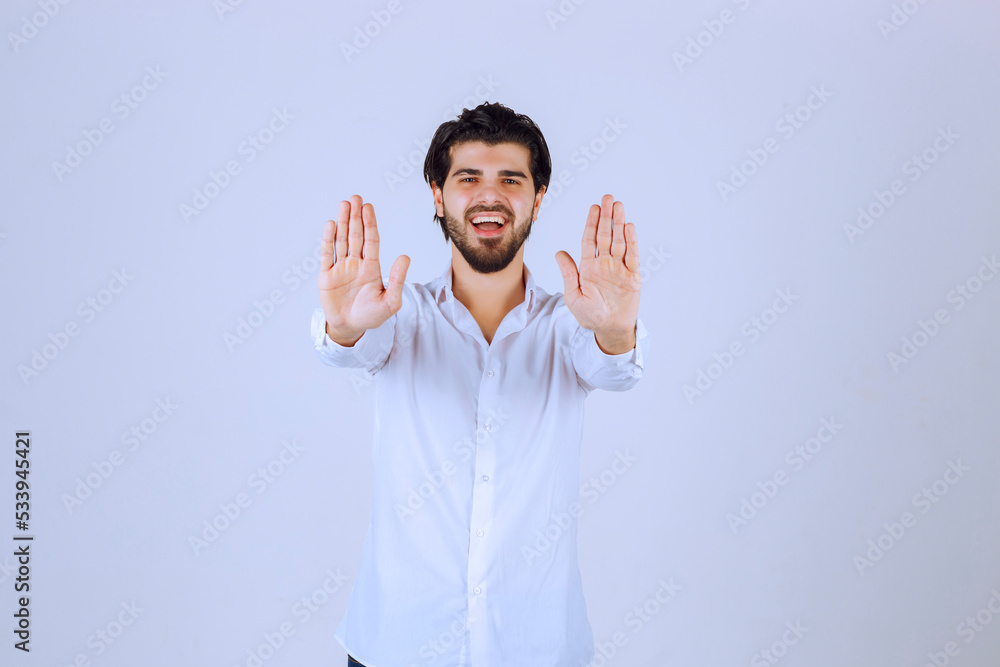 Man trying to refuse and prevent something Man trying to refuse and prevent something