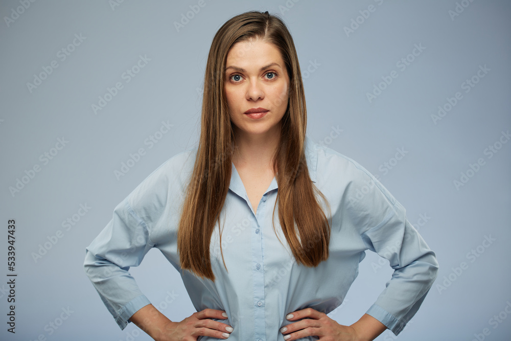 Portrait of serious confident woman in blue shirt. Portrait of serious confident woman in blue shirt.