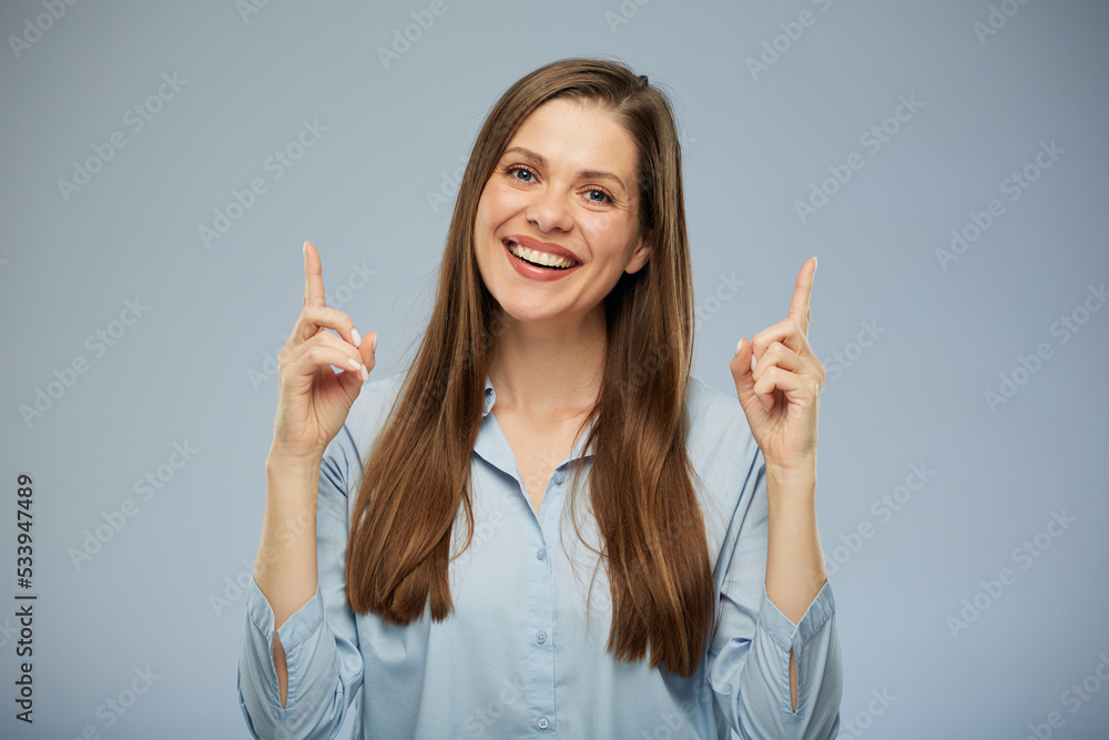 Smiling woman pointing fingers up. Smiling woman pointing fingers up.