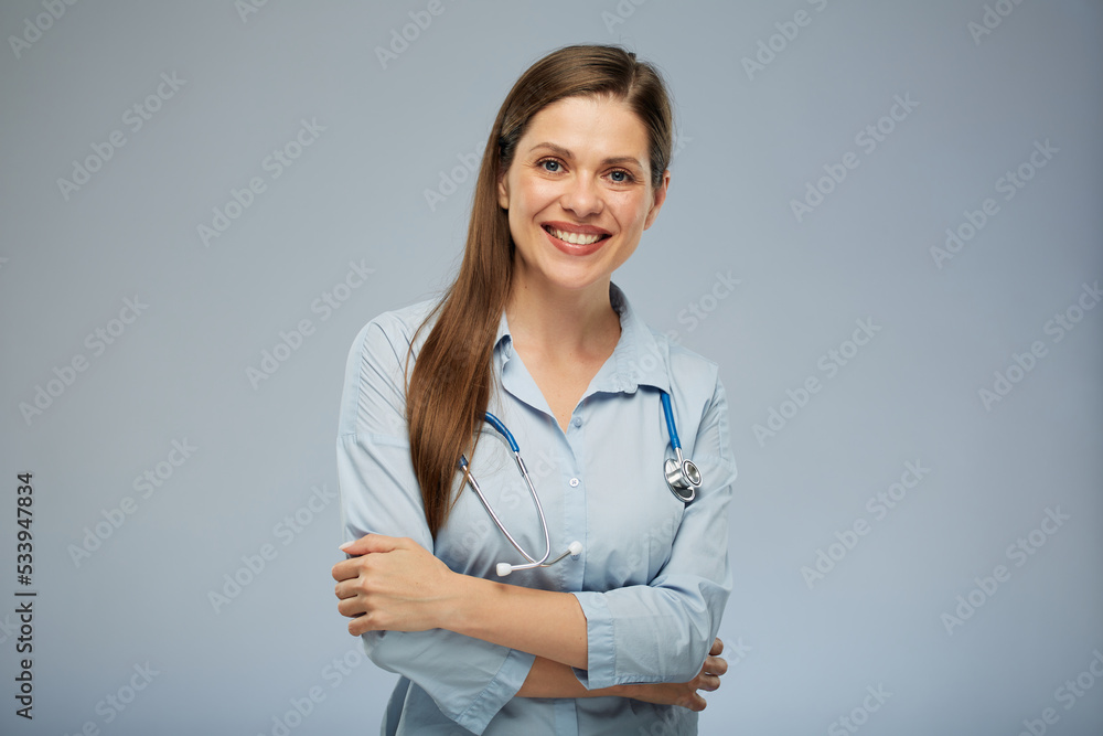 Smiling positive emotional doctor woman in medical uniform. Isolated portrait of female medical worker Smiling positive emotional doctor woman in medical uniform. Isolated portrait of female medical worker
