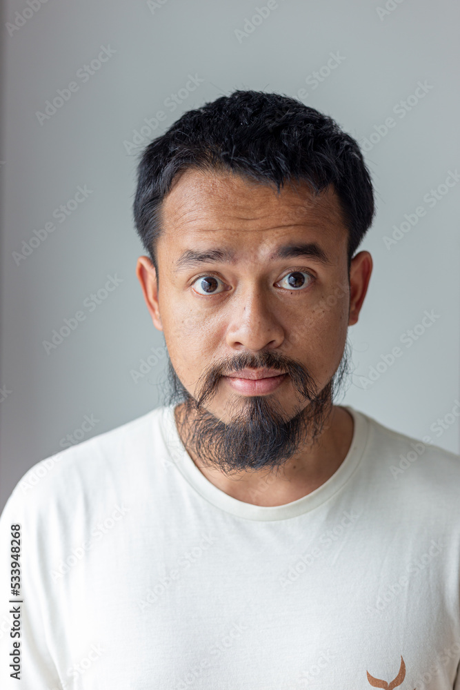 Handsome mustache asian man smiling and laughing Handsome mustache asian man smiling and laughing