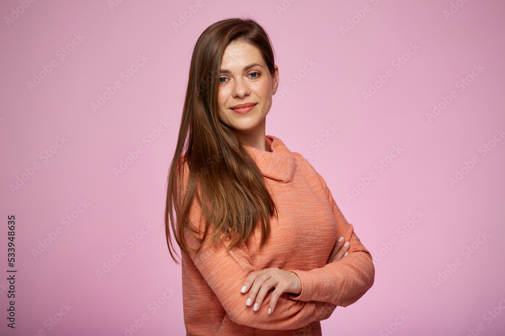 Obraz premium Smiling, happy woman, dressed in teenage style, against pink background.