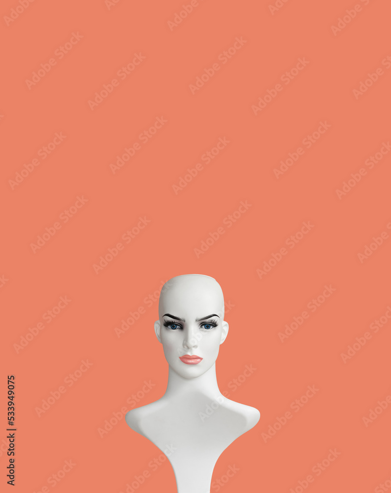 White plastic female mannequin doll portrait on powder color background White plastic female mannequin doll portrait on powder color background