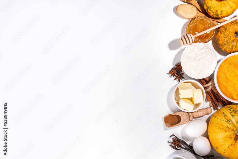 Set of pumpkin pie ingredients - pumpkin puree, spices, cinnamon, dough ingredients, floue, eggs, butter, cream milk, copy space Set of pumpkin pie ingredients - pumpkin puree, spices, cinnamon, dough ingredients, floue, eggs, butter, cream milk, copy space