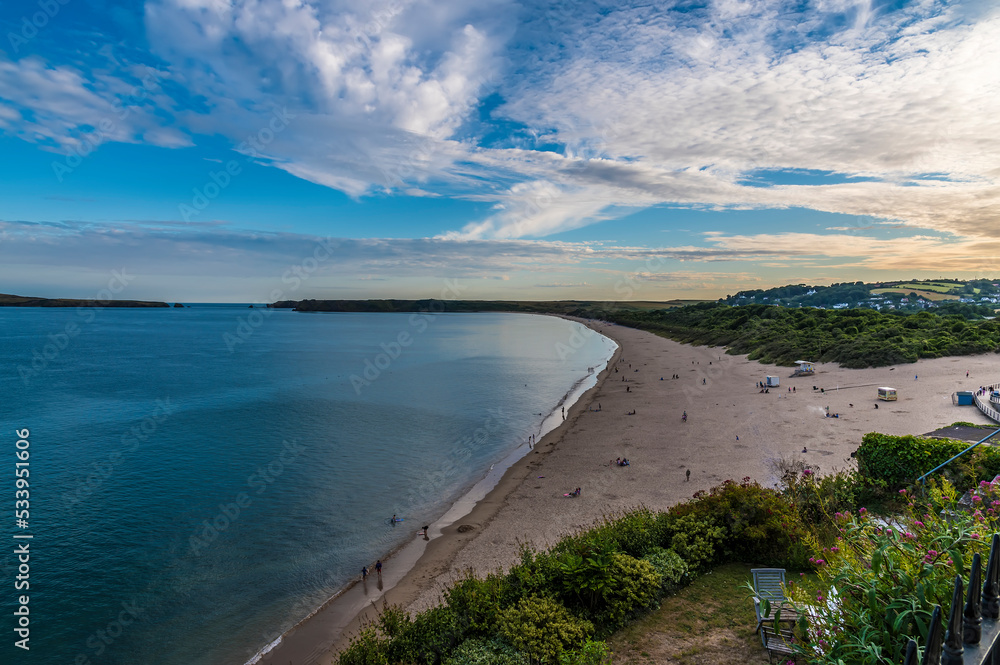 A view along the South Beach in Tenby, Pembrokeshire, Wales on a summers evening