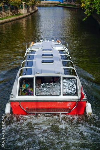 Vertical shot of a touristic boat on the Porsuk river in Eskisehir, Turkey photo