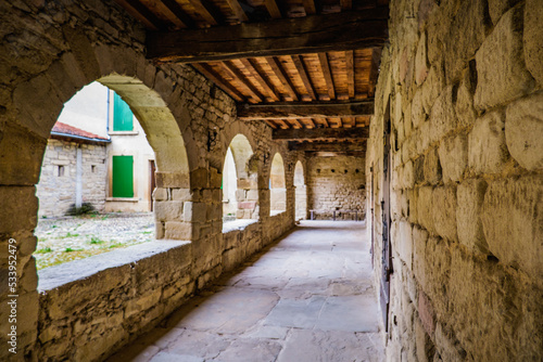 Fototapeta The covered archways of the medieval cloister of Saint Agnes priory in Saint Jea