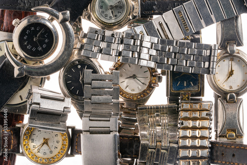 Fotografija Wrist watch with metal wristlets and leather watchstraps