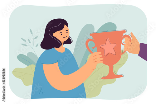 Hand giving winners gold cup to happy girl. Female character receiving victory award flat vector illustration. Prize, bonus, competition concept for banner, website design or landing web page