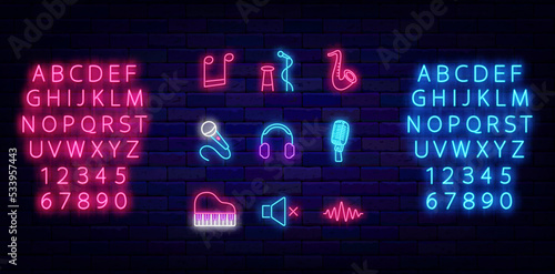 Music neon icons collection. Luminous pink and blue alphabet. Stand up symbol. Vector stock illustration photo