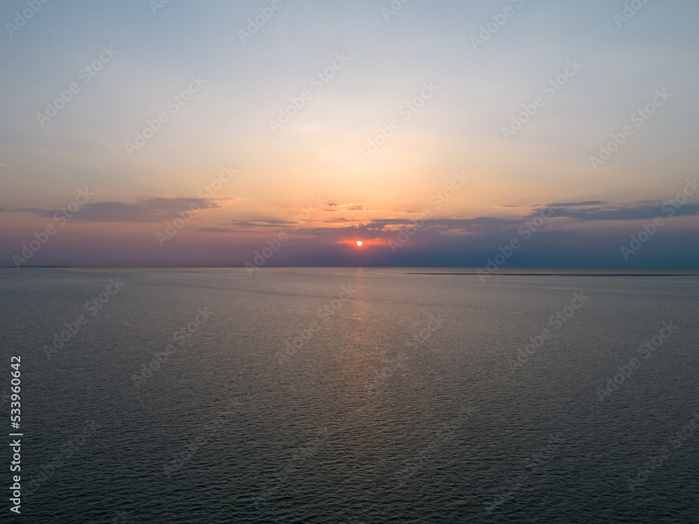 sunset sea calm water