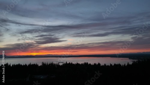 Drone shot of a warm red sunset over the Western Washington University campus. photo