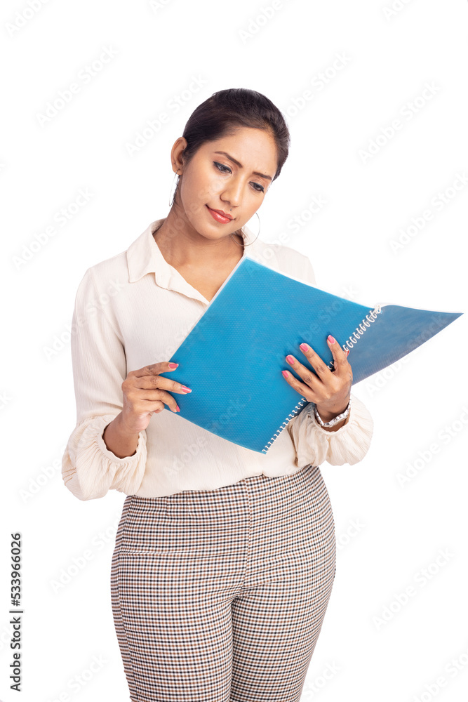 Young business woman looking at the file on white. Young business woman looking at the file on white.