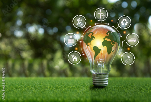 The green world map is on a light bulb that represents green energy Renewable energy that is important to the world. Renewable Energy.Environmental protection, renewable, sustainable energy sources.