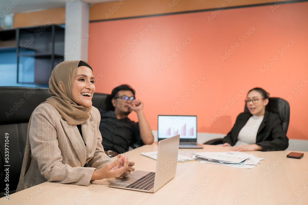 business muslim and asian woman and man have meeting. adult worker present showing benefit for company. international convention room with group of diversity people having a conversation in workplace business muslim and asian woman and man have meeting. adult worker present showing benefit for company. international convention room with group of diversity people having a conversation in workplace