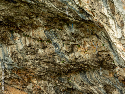 rock climbing route with cables and carabiner