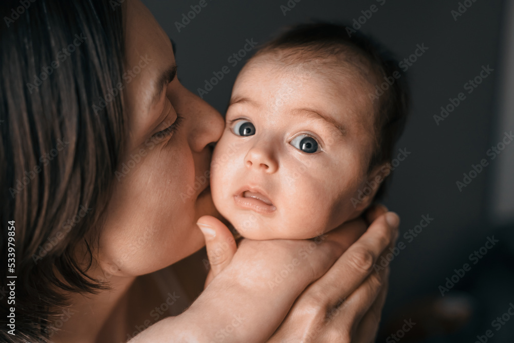 Mom, mummy, young mother with little baby daughter. Breast-feeding. Mum kissing,hugging child. Newborn cute happy girl smiling in woman hands. Family happiness. Age parents, parenting, motherhood Mom, mummy, young mother with little baby daughter. Breast-feeding. Mum kissing,hugging child. Newborn cute happy girl smiling in woman hands. Family happiness. Age parents, parenting, motherhood